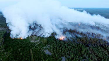 An aerial view shows a forest fire raging in Kalajoki, Northern Ostrobothnia region, north-western Finland, on July 26, 2021. (AFP)