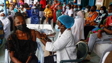 Aminata Laye Diagne, a nurse gives a dose of coronavirus disease (COVID-19) vaccine to a woman at Philippe Senghor Hospital in Dakar, amid a surge of coronavirus disease (COVID-19) cases in Senegal July 28, 2021. (Reuters)