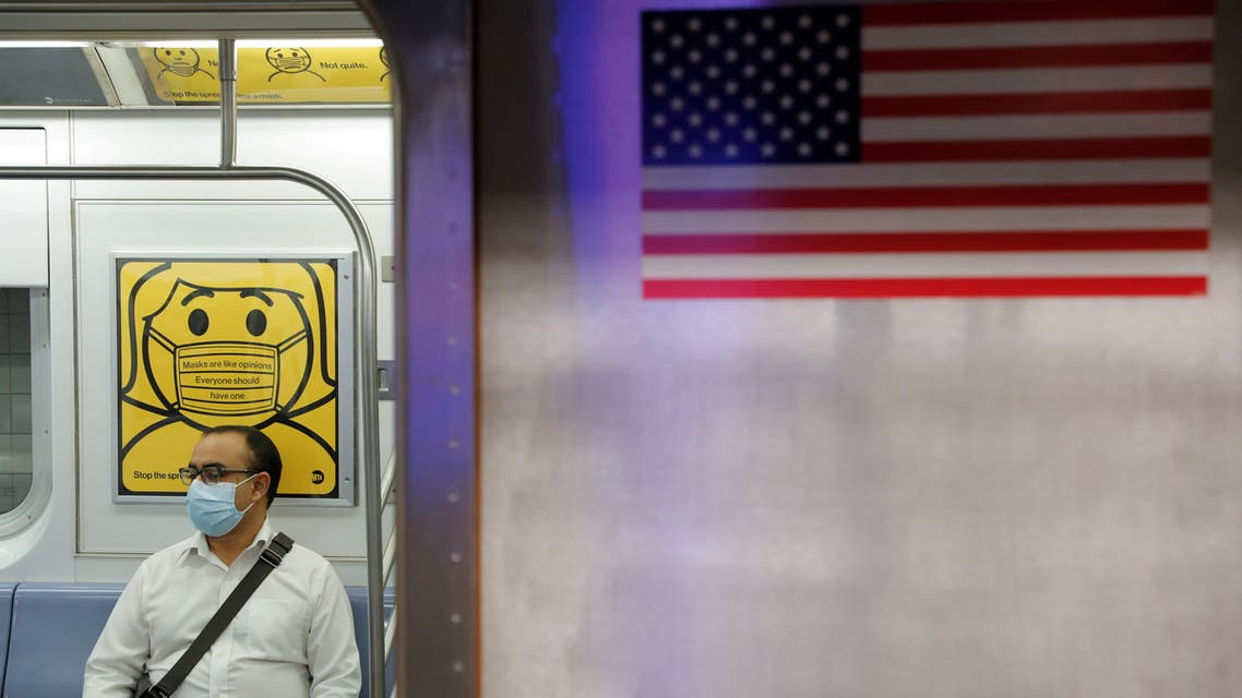 FILE PHOTO: A commuter wears a mask while riding the subway as cases of the infectious coronavirus Delta variant continue to rise in New York City, New York, U.S., July 26, 2021. REUTERS/Andrew Kelly/File Photo