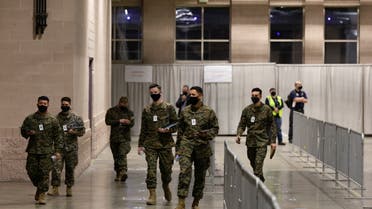 Military personnel walk through at one of FEMA's Community Vaccination Center in Philadelphia, Pennsylvania, U.S., March 2, 2021. (Reuters)