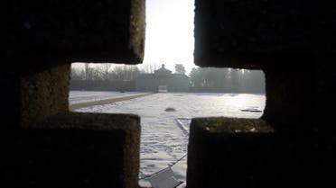 The entrance of the former Nazi concentration camp Sachsenhausen is pictured behind a sculpture near the German capital Berlin January 27, 2006. International Holocaust Remembrance is being marked around the world today. (Reuters)