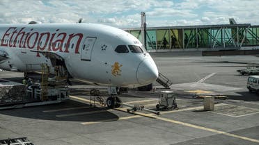 People board an Ethiopian Airlines plane at the Bole International Airport, in Addis Ababa, on March 17, 2020. (Eduardo Soteras/AFP)