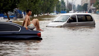 Death toll from China floods jumps to 302 with 50 people missing