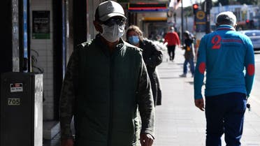 Residents walk through a street in the Fairfield suburb in Sydney on August 2, 2021, during the city's prolonged Covid-19 coronavirus lockdown. (File photo: AFP)