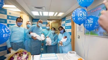 Ahmed, Adam, Mohamed and Malek, weighing between 1.6kg to 2kg, arrived into the world on July 6, 2021. They are pictures here with medical staff at NMC Royal Hospital, Sharjah, in the United Arab Emirates. (Supplied)