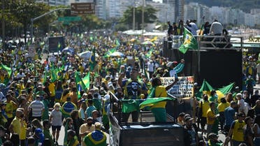 Supporters of Brazilian President Jair Bolsonaro take part in a demonstration calling for the addition of paper voting receipts to electronic ballots in the presidential election, at Copacabana Beach in Rio de Janeiro, Brazil on August 1, 2021. (Andre Borges/AFP)