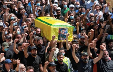 Mourners carry the coffin of Hezbollah member Ali Shibli, who was killed on Saturday, during his funeral in the village of Kunin, southern Lebanon August 2, 2021. (Reuters)