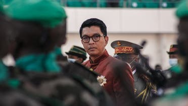 In this file photograph taken on June 26, 2021, Madagascar’s President Andry Rajoelina inspects troops during Independence Day celebrations at The Barea Stadium in Antananarivo. (Rijasolo/AFP)