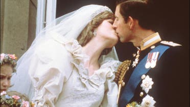 In this file photo taken on July 29, 1981 Charles, Prince of Wales, kisses his bride, Lady Diana, on the balcony of Buckingham Palace when they appeared before a huge crowd, after their wedding in St Paul's Cathedral. London, July 29, 1981. File photo: AFP)
