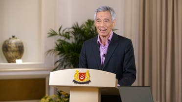 Prime Minister Lee Hsien Loong addresses the nation with updates on the COVID-19 situation in the city state Monday, May 31, 2021, in Singapore. (Ministry of Communications and Information via AP)