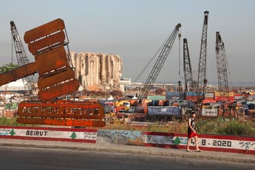 A justice symbol monument is seen near the grain silo damaged during last year's Beirut port blast, Aug. 4, 2021. (Reuters)
