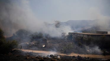Fields burn following a hit by a rocket fired from Lebanon into Israeli territory, Aug. 4, 2021. (AP)