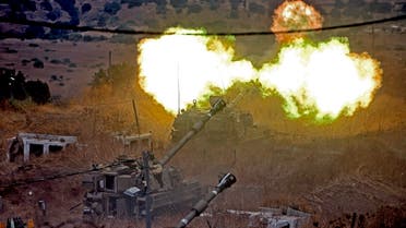 Israeli self-propelled howitzers fire towards Lebanon following rocket fire from Lebanon’s Hezbollah, on Aug. 6, 2021. (AFP)