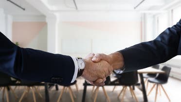 Stock image of two people shaking hands. (Pixabay)