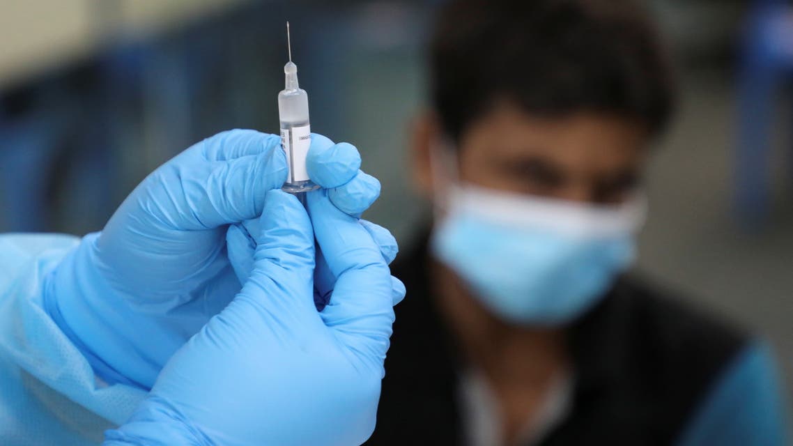 A medical worker prepares a dose of Biokangtai's coronavirus disease (COVID-19) vaccine during a vaccination program at a factory, in Pulau Indah, Malaysia July 8, 2021. (Reuters)
