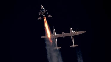 Virgin Galactic's passenger rocket plane VSS Unity, carrying Richard Branson and crew, begins its ascent to the edge of space above Spaceport America near Truth or Consequences, New Mexico, U.S. July 11, 2021 in a still image from video. (Reuters)