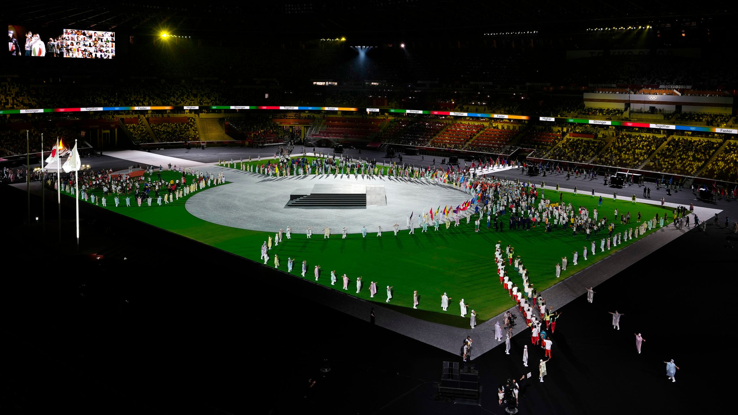 Athletes enter the stadium during the closing ceremony in the Olympic Stadium at the 2020 Summer Olympics, Sunday, Aug. 8, 2021, in Tokyo, Japan. (AP)