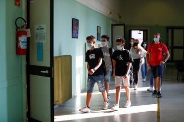 Students wearing protective face masks return to school. (File photo: Reuters)