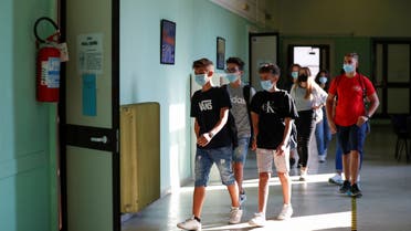 Students wearing protective face masks return at the Liceo Isacco Newton high school for the first time since March, adhering to strict regulations to avoid coronavirus disease (COVID-19) contagion in Rome, Italy September 14, 2020. REUTERS/Yara Nardi