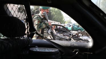 An Afghan National Army (ANA) soldier keeps watch at the site of yesterday's night-time car bomb blast in Kabul, Afghanistan August 4, 2021. REUTERS/Stringer