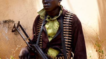 In this file photo taken on February 14, 2019, a member of SPLA-IO stands guard as peace talks take place in Pageri, Imatong State, South Sudan. (Alex McBride/AFP)