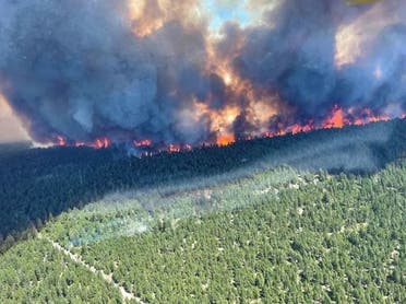 This handout photo courtesy of BC Wildfire Service shows the Sparks Lake wildfire, British Columbia, seen from the air on June 29, 2021. (AFP)