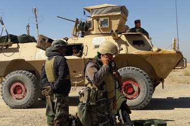 Afghan security forces stand near an armoured vehicle during ongoing fighting between Afghan security forces and Taliban fighters in the Busharan area on the outskirts of Lashkar Gah, the capital city of Helmand province May 5, 2021. (File photo: AFP)