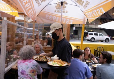 Food is served to guests at a restaurant in Manhattan, after New York City Mayor Bill de Blasio announced that proof of coronavirus disease (COVID-19) vaccination will be required for customers and staff at restaurants, gyms and other indoor businesses, in New York City, U.S., August 3, 2021. (Reuters)