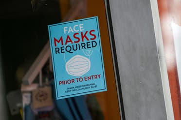 A sign at the entry to a beauty salon informs of mask requirement due to the coronavirus disease (COVID-19) measures in the Bronx borough of New York City, U.S., July 27, 2021. (Reuters)