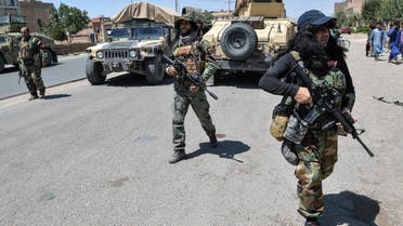 In this picture taken on August 1, 2021, Afghan National Army commando forces walk along a road amid ongoing fighting between Taliban and Afghan security forces in the Enjil district of Herat province. (AFP)