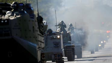 Brazilian Navy tanks pass in front of the Planalto presidential palace during a military parade in Brasilia, Brazil August 10, 2021. (Reuters/Adriano Machado)