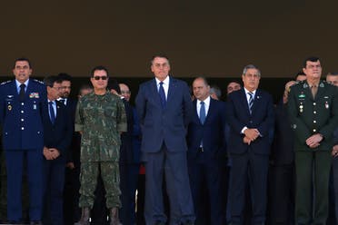 Brazil’s President Jair Bolsonaro looks on before Brazilian Navy tanks pass in front of the Planalto presidential palace during a military parade in Brasilia, Brazil August 10, 2021. (Reuters/Adriano Machado)