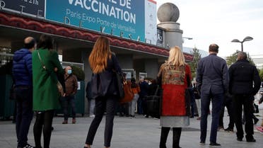 People queue outside a mass vaccination center in Paris, as part of the coronavirus disease (COVID-19) vaccination campaign in France, May 12, 2021. (Reuters/Sarah Meyssonnier)