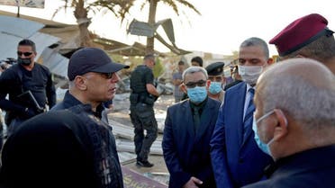 Iraqi Prime Minister al-Kadhemi (L) during a tour in the holy Shia city of Karbala, south of the capital Baghdad, on August 11, 2021. (Iraq’s Prime Minister’s Press Office/AFP)