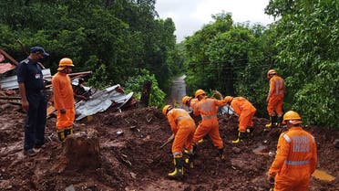 In this handout photo taken on July 25, 2021 and released by India's National Disaster Response Force (NDRF), shows NDRF personnel conducting search and rescue operations at the site of a landslide after heavy monsoon rains at Kumbharwadi village in Chiplun district of Maharashtra. (File photo: AFP)