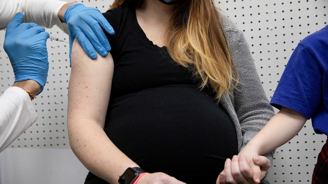 A pregnant woman receives a vaccine for the coronavirus disease (COVID-19) at Skippack Pharmacy in Schwenksville, Pennsylvania, US, February 11, 2021. (Reuters/Hannah Beier)