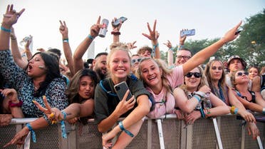Festival goers attend day four of the Lollapalooza Music Festival on Sunday, Aug. 1, 2021, at Grant Park in Chicago. (Photo by Amy Harris/Invision/AP)