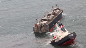 Ship snaps in two after running aground in northern Japan, crew safe