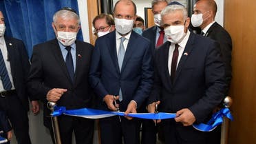 Israeli Foreign Minister Yair Lapid inaugurates Israel's diplomatic mission, in the presence of Minister Delegate to the Moroccan Foreign Ministry Mohcine Jazouli, in Rabat, Morocco August 12, 2021. (Reuters)