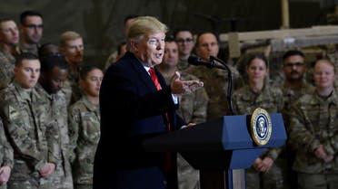 US President Donald Trump and Joint Chiefs Chairman General Mark Milley (L) arrive to meet the troops during a surprise Thanksgiving day visit at Bagram Air Field, on November 28, 2019 in Afghanistan.