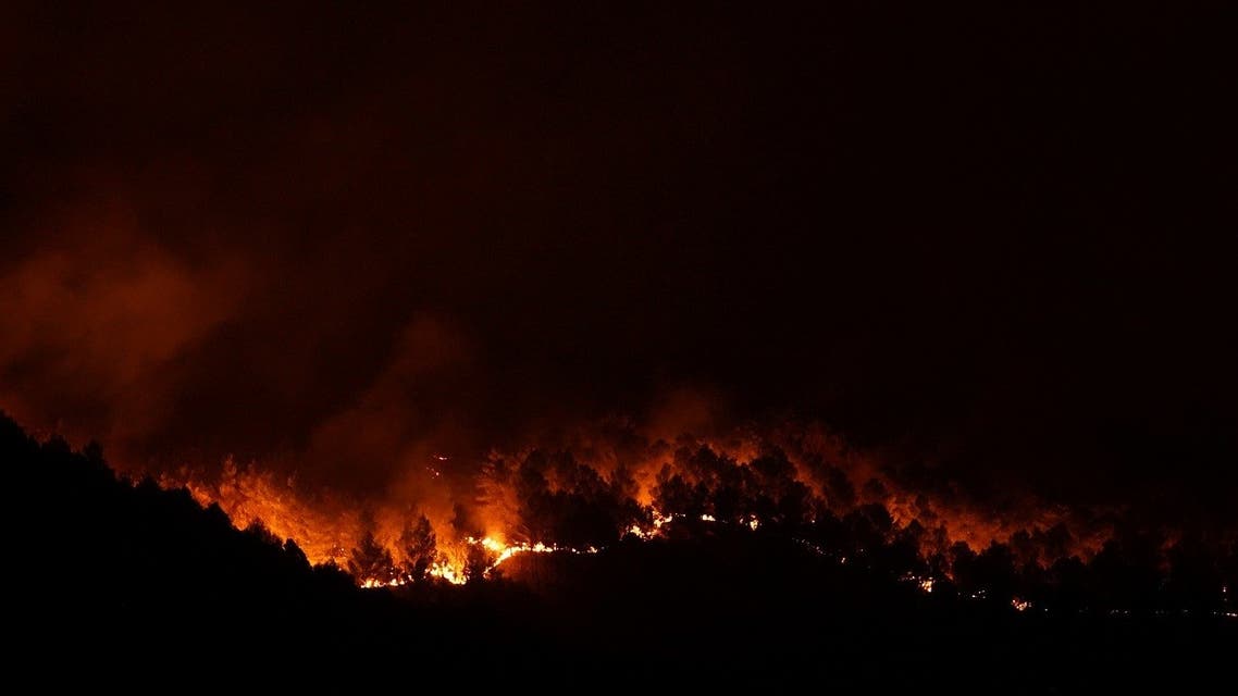 Fire rages in Giarratana, on the island of Sicily, Italy, on August 11, 2021. (Reuters)