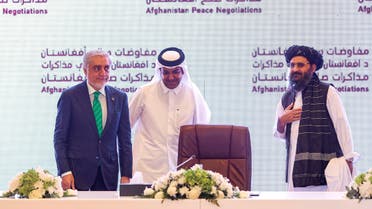 (L to R) The head of Afghanistan's High Council for National Reconciliation Abdullah Abdullah, Qatar's envoy on counter-terrorism Mutlaq al-Qahtani, and the leader of the Taliban negotiating team Mullah Abdul Ghani Baradar look on during the final declaration of the peace talks between the Afghan government and the Taliban in Qatar's capital Doha on July 18, 2021. Representatives of the Afghan government and Taliban insurgents held talks in Doha as violence raged in their country with foreign forces almost entirely withdrawn. The two sides have been meeting on and off for months in the Qatari capital, but the talks have lost momentum as the insurgents made battlefield gains.