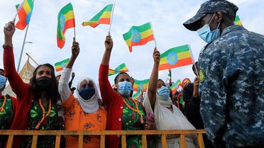 Women hold national flags during a rally to support the National Defense Force and to condemn the expansion of the Tigray People Liberation Front (TPLF) fighters into Amhara and Afar regional territories at the Meskel Square in Addis Ababa, Ethiopia, on August 8, 2021. (Reuters)