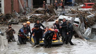 Search and Rescue team members evacuate locals during flash floods which have swept through towns in the Turkish Black Sea region, in Bozkurt, a town in Kastamonu province, Turkey, August 12, 2021. (Reuters)