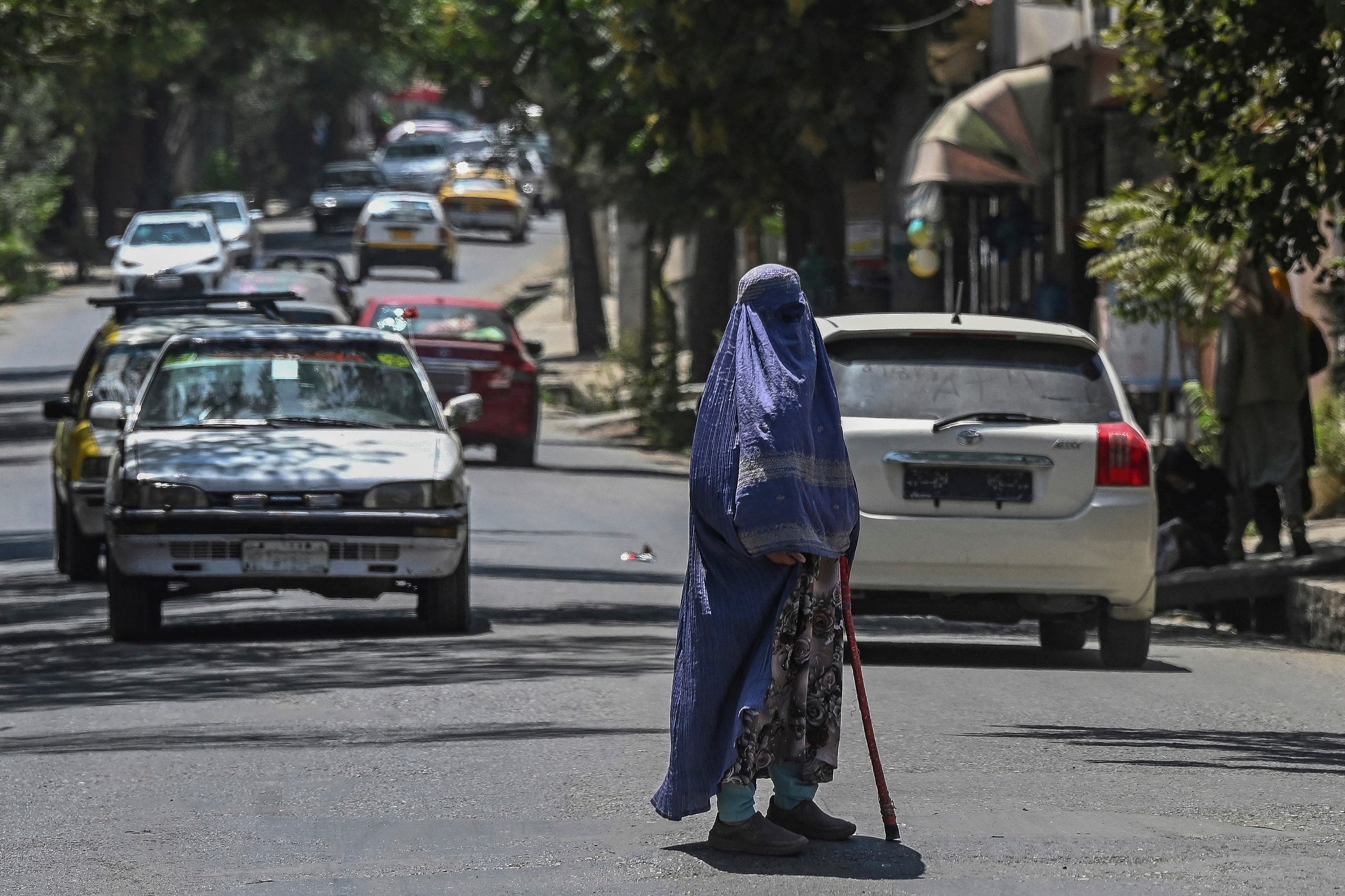 An Afghan woman wearing traditional dress in central Kabul last week