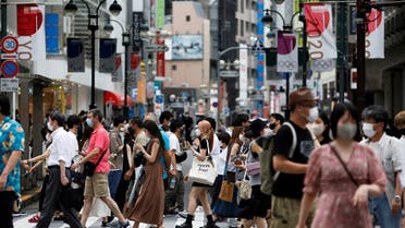 People walk at a crossing in Shibuya shopping area, amid the coronavirus disease (COVID-19) outbreak in Tokyo, Japan August 7, 2021. (Reuters)