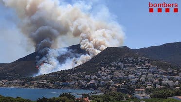 A handout picture released by Catalonia's firefighting squad (Bombers Generalitat Catalunya) shows smoke billowing from a fire raging near El Port de la Selva and Llanca close to the Cap de Creus Natural Park on July 16, 2021.(File photo: AFP)