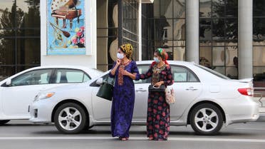 Women wearing protective face masks, used as a preventive measure against the spread of the coronavirus disease (COVID-19), cross a road in Ashgabat, Turkmenistan July 15, 2020. (Reuters)