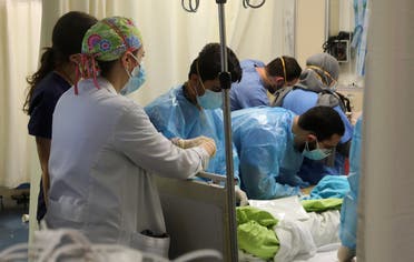 US-trained emergency doctor Nour al-Jalbout (L) is pictured during her shift in the emergency department of the AUBMC (American University of Beirut Medical Centre) in the Lebanese capital Beirut on March 17, 2021. (File photo: AFP)