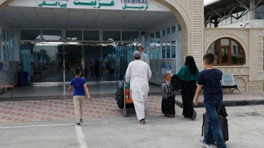 Passengers enter the departures terminal of Hamid Karzai International Airport, in Kabul, Afghanistan, Saturday, Aug. 14, 2021. (AP)